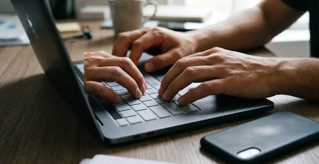 Close-up of hands showing authentication frustration during login process